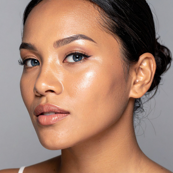 Close-up of a woman's face with a neutral background