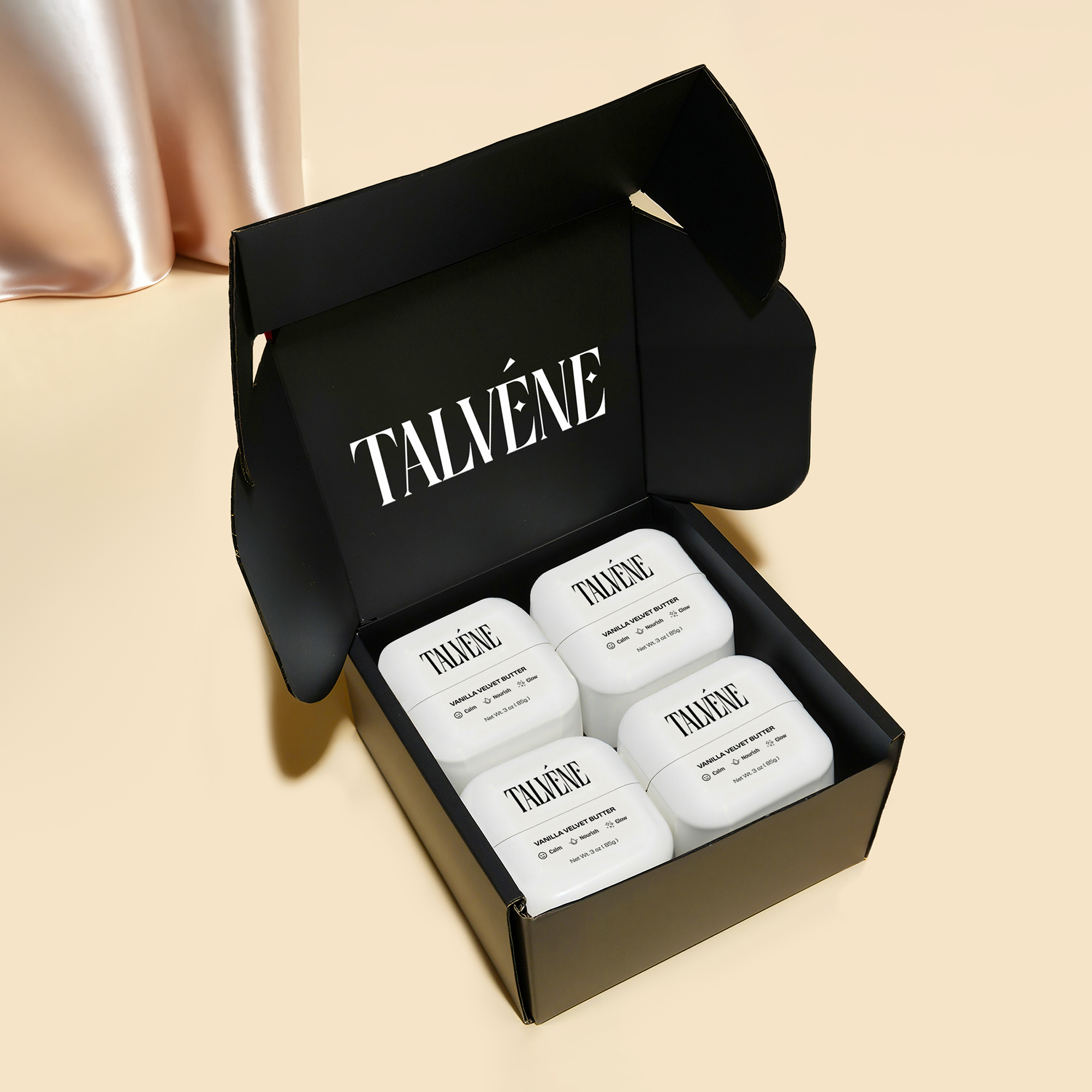 Talvéne skincare products in a black box on a beige background